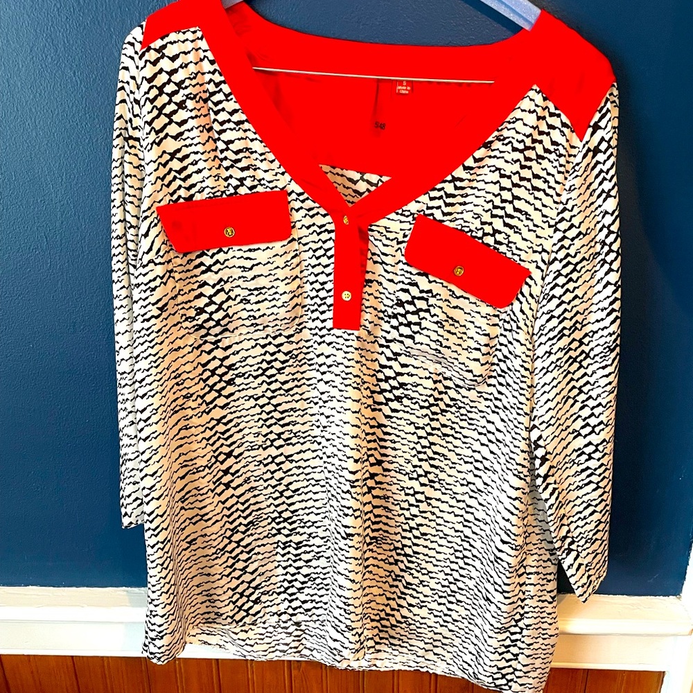 Red and white silky blouse